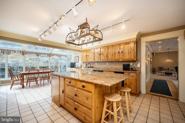 1909 Marsh Hill Rd, Mc Henry, MD 21541 - kitchen with an inviting chandelier, light tile patterned floors, a breakfast bar, decorative backsplash, and a kitchen island