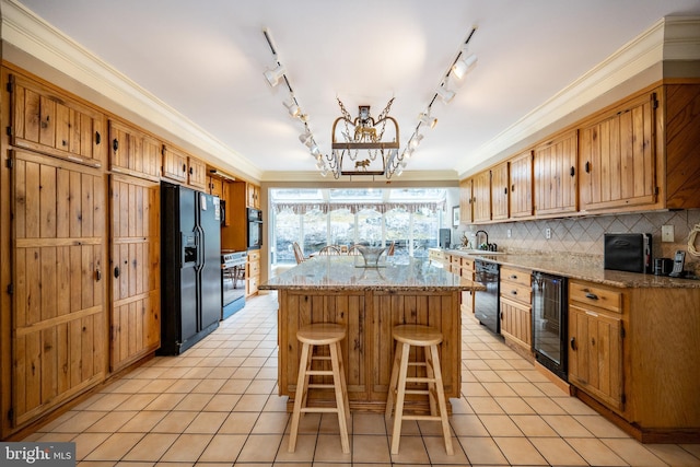 1909 Marsh Hill Rd, Mc Henry, MD 21541 - kitchen with a kitchen island, beverage cooler, black appliances, decorative backsplash, and an inviting chandelier