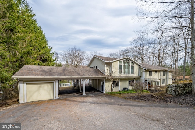1909 Marsh Hill Rd, Mc Henry, MD 21541 - view of front of home with aphalt driveway, a garage, and a carport