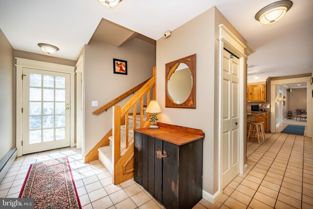 1909 Marsh Hill Rd, Mc Henry, MD 21541 - foyer entrance featuring light tile patterned flooring, baseboards, stairway, and baseboard heating