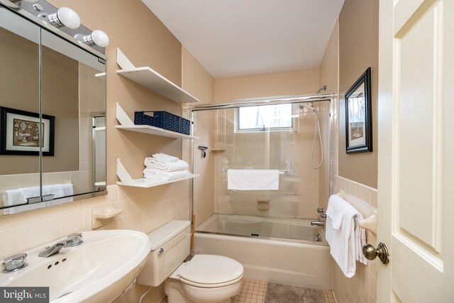 1909 Marsh Hill Rd, Mc Henry, MD 21541 - full bath with tile walls, toilet, bath / shower combo with glass door, tile patterned floors, and a sink