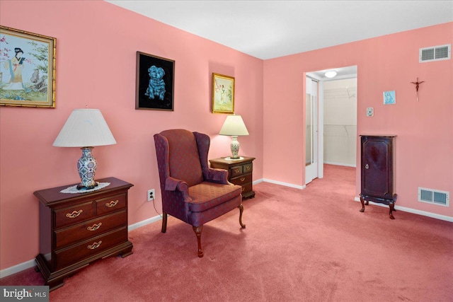 sitting room with baseboards, carpet, and visible vents