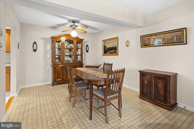 dining area featuring baseboards and a ceiling fan