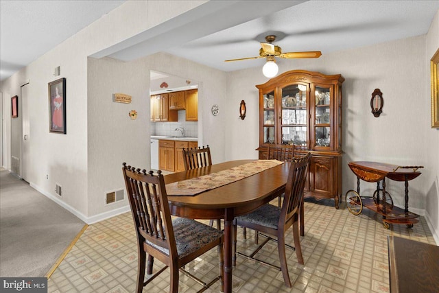 dining room featuring visible vents, baseboards, and ceiling fan