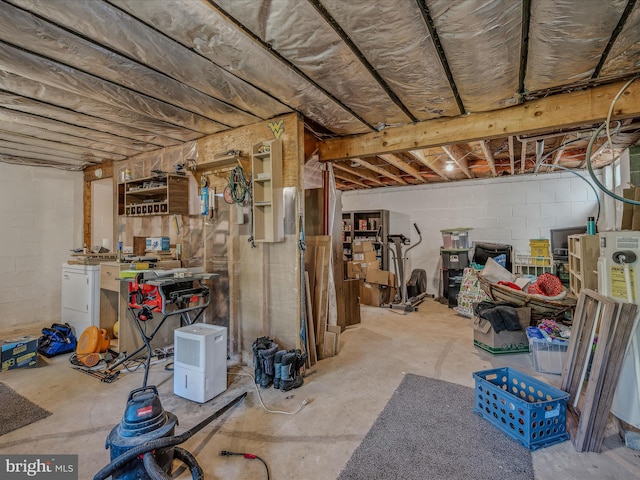 unfinished below grade area featuring concrete block wall