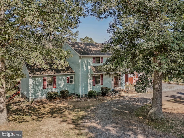 view of front of house with roof with shingles