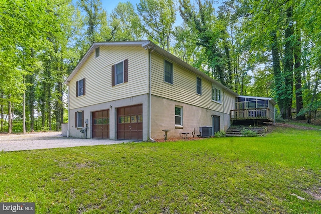 7000 Burch Hill Rd, Brandywine, MD 20613 - back of house with central AC, driveway, an attached garage, and a yard