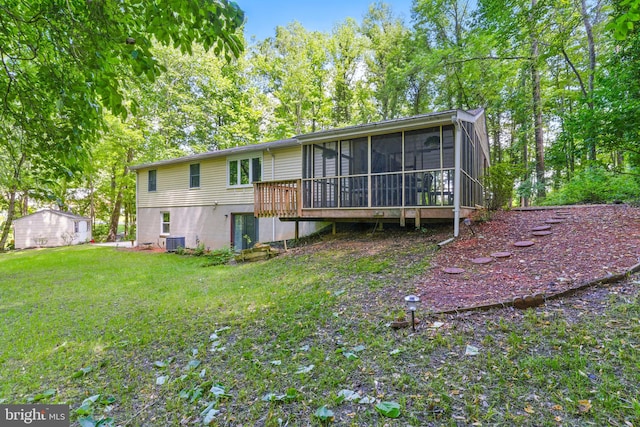 7000 Burch Hill Rd, Brandywine, MD 20613 - back of house with a sunroom, a lawn, and central AC