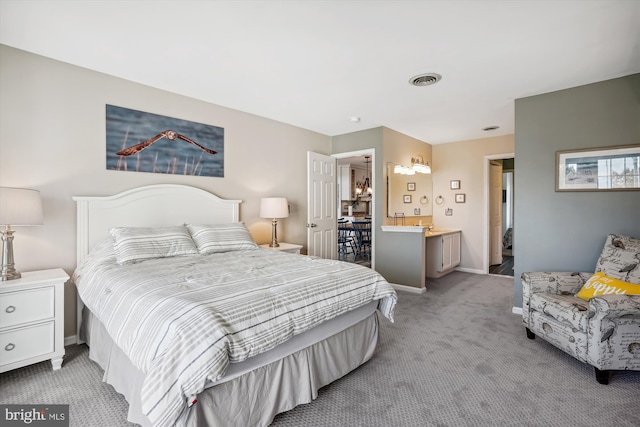bedroom featuring baseboards, light colored carpet, and visible vents