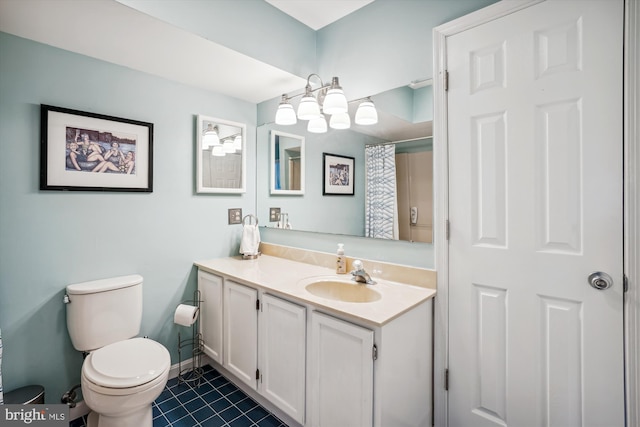 bathroom with a shower with curtain, vanity, toilet, baseboards, and tile patterned floors