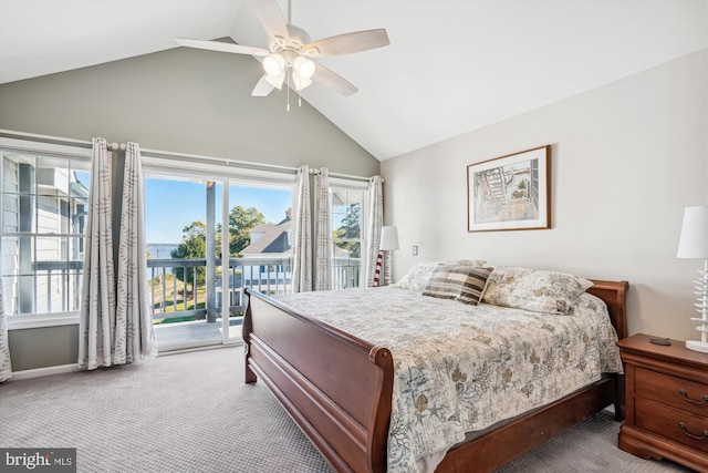 carpeted bedroom with access to exterior, a ceiling fan, and vaulted ceiling
