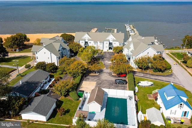 drone / aerial view with a residential view and a water view