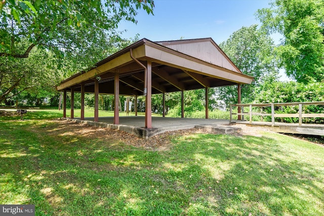 surrounding community with a gazebo and a yard
