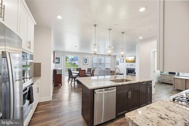 2101 Gails Ln, Mount Airy, MD 21771 - kitchen featuring dark wood-type flooring, dark brown cabinets, a sink, stainless steel appliances, and a center island with sink