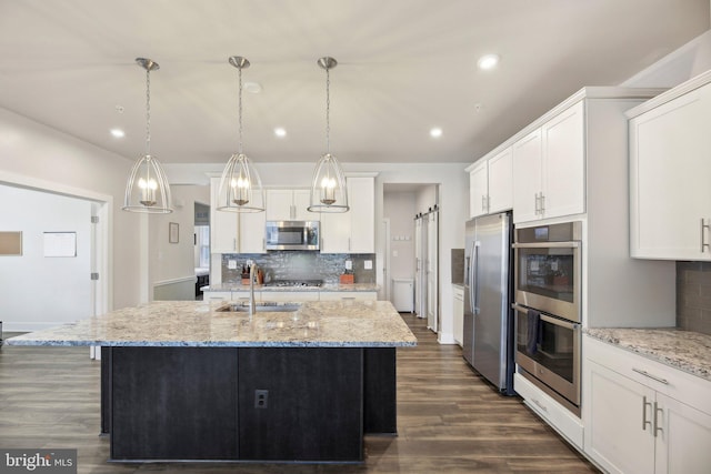 2101 Gails Ln, Mount Airy, MD 21771 - kitchen with dark wood-type flooring, white cabinets, appliances with stainless steel finishes, a sink, and backsplash