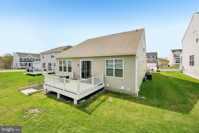 2101 Gails Ln, Mount Airy, MD 21771 - rear view of house featuring central AC, a shingled roof, a wooden deck, and a lawn