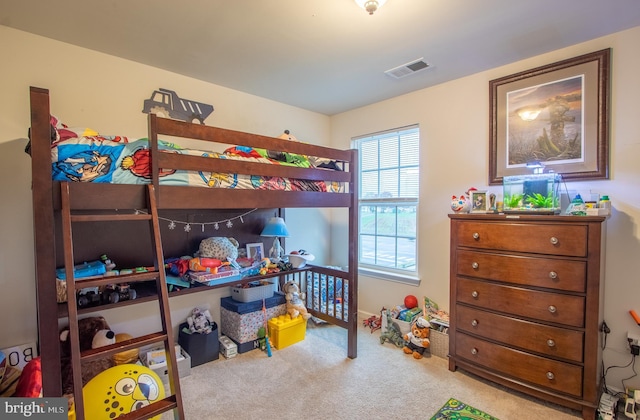 bedroom featuring carpet flooring and visible vents