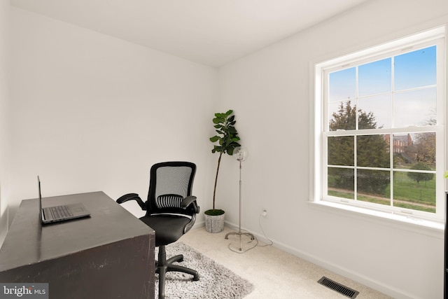 home office with baseboards, visible vents, and carpet