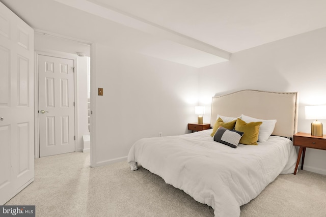carpeted bedroom with baseboards
