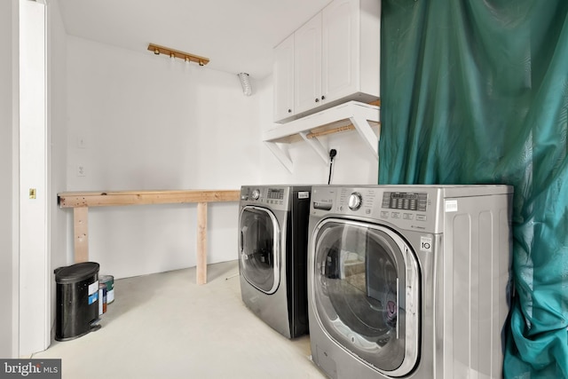 laundry room featuring washing machine and clothes dryer and laundry area