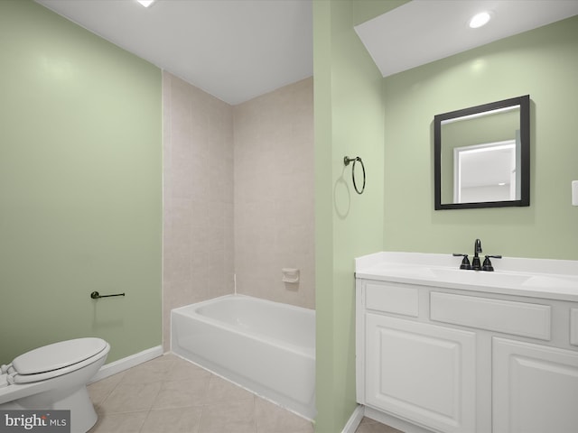 bathroom featuring baseboards, toilet, tile patterned floors, and vanity