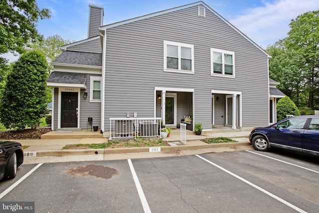 13663 Orchard Dr Unit 3663, Clifton, VA 20124 - view of front of property with uncovered parking, a chimney, and roof with shingles