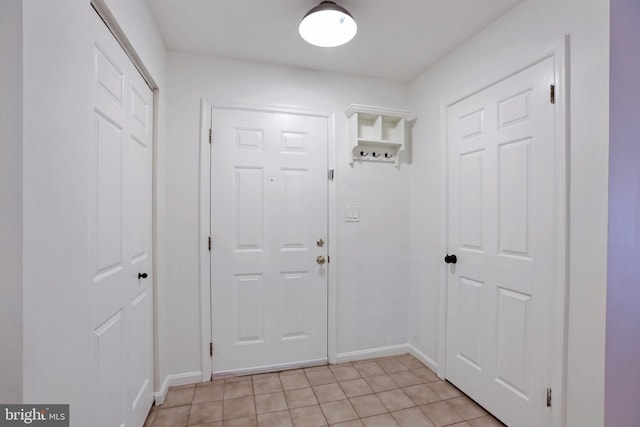 13663 Orchard Dr Unit 3663, Clifton, VA 20124 - doorway to outside featuring baseboards and light tile patterned floors