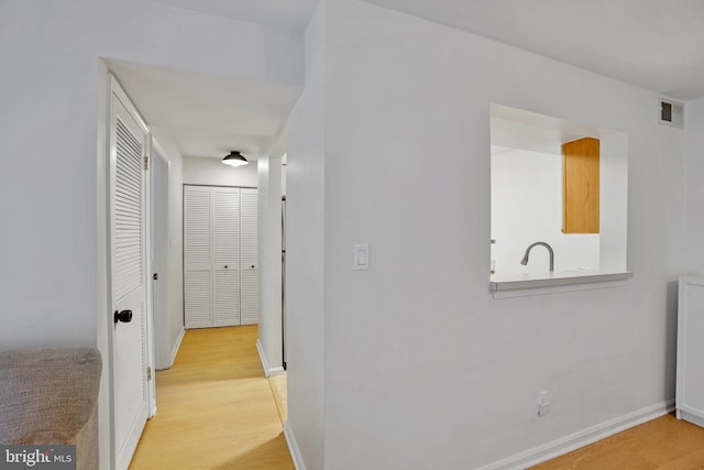 13663 Orchard Dr Unit 3663, Clifton, VA 20124 - corridor with light wood-style flooring and baseboards
