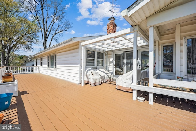wooden deck with a pergola