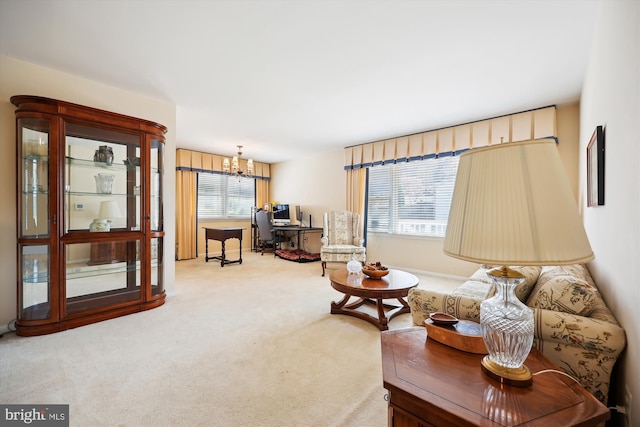 living room with carpet flooring and a notable chandelier