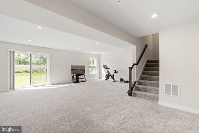 exercise room featuring baseboards, carpet flooring, recessed lighting, and visible vents