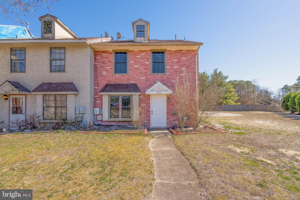 903 Blake Dr, Mays Landing, NJ 08330 - view of front facade with stucco siding, brick siding, fence, and a front lawn
