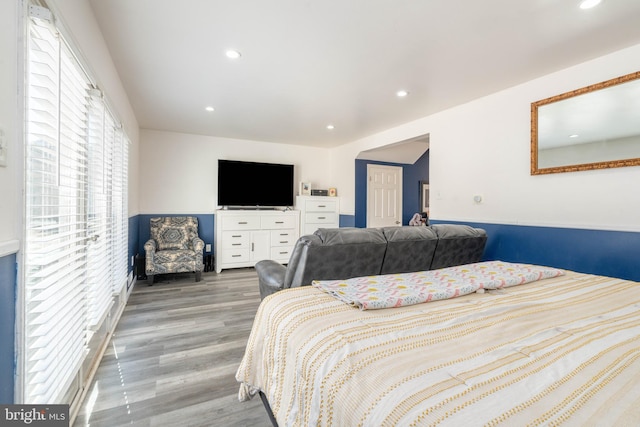 bedroom with wood finished floors and recessed lighting