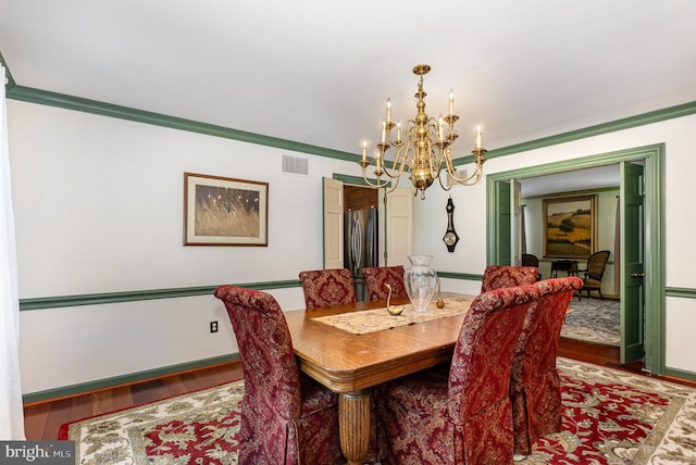 4300 Valleyview Rd, Harrisburg, PA 17112 - dining area with a chandelier, wood finished floors, and ornamental molding