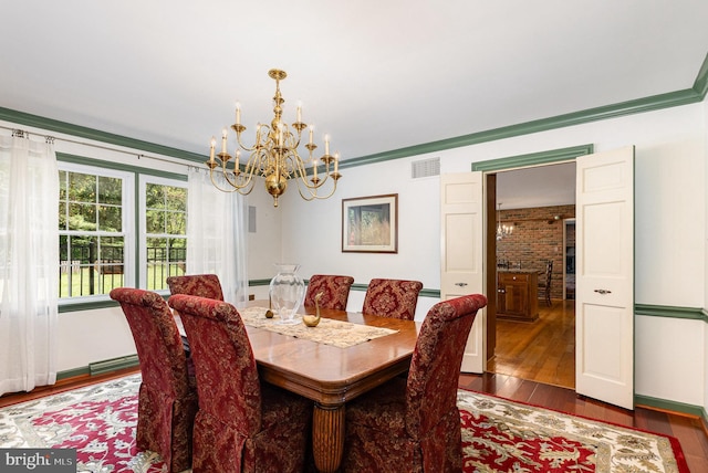 4300 Valleyview Rd, Harrisburg, PA 17112 - dining area with a chandelier, dark wood-style flooring, crown molding, and baseboards