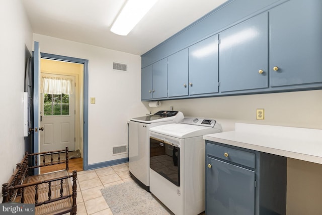 4300 Valleyview Rd, Harrisburg, PA 17112 - clothes washing area featuring cabinet space, washer and clothes dryer, light tile patterned flooring, and baseboards