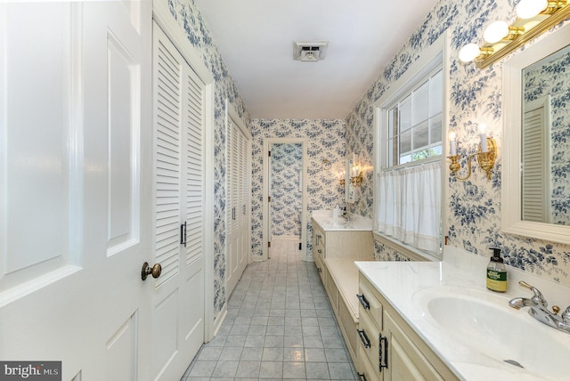4300 Valleyview Rd, Harrisburg, PA 17112 - bathroom with wallpapered walls, vanity, and a closet