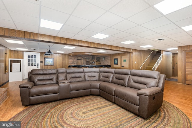 4300 Valleyview Rd, Harrisburg, PA 17112 - living room featuring wood finished floors, wooden walls, stairway, and a paneled ceiling