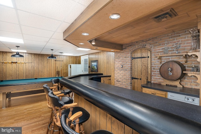 4300 Valleyview Rd, Harrisburg, PA 17112 - indoor dry bar with wooden walls, wood finished floors, billiards table, brick wall, and recessed lighting