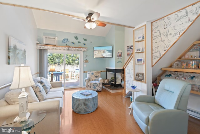 2818 Tern Dr Unit 9, Ocean City, MD 21842 - living area with ceiling fan, wood finished floors, stairway, a baseboard heating unit, and a wall unit AC