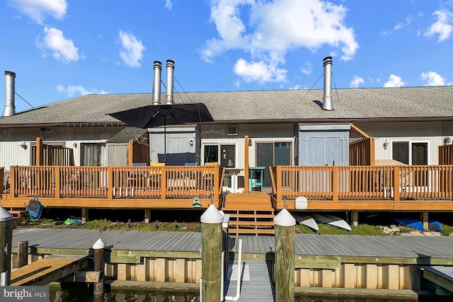 2818 Tern Dr Unit 9, Ocean City, MD 21842 - rear view of house with a shingled roof and a wooden deck