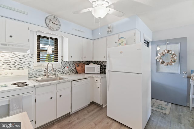 2818 Tern Dr Unit 9, Ocean City, MD 21842 - kitchen with white cabinets, a sink, under cabinet range hood, and white appliances