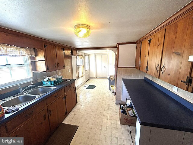 6637 Elton Dennis Rd, Willards, MD 21874 - kitchen with light floors, dark countertops, a sink, and a wealth of natural light