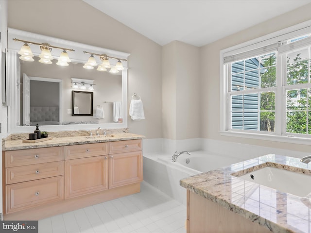 bathroom featuring vanity, tile patterned floors, a bath, and lofted ceiling