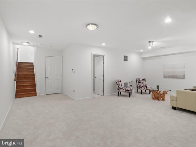 living area featuring recessed lighting, carpet, stairs, and baseboards
