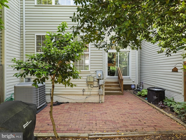 view of patio / terrace with central air condition unit and entry steps