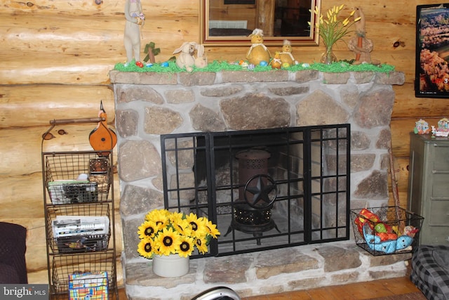 room details featuring a fireplace and rustic walls