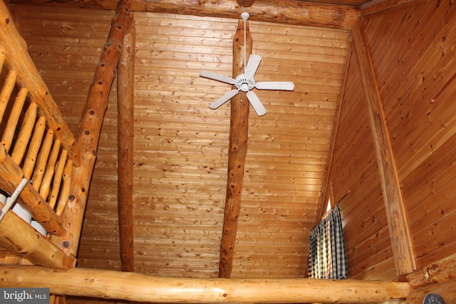 interior details featuring wood walls and ceiling fan