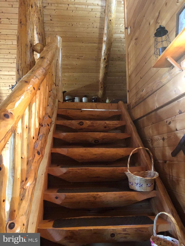 staircase with wood walls