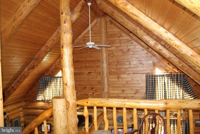 interior space featuring log walls, vaulted ceiling with beams, a ceiling fan, and wooden ceiling